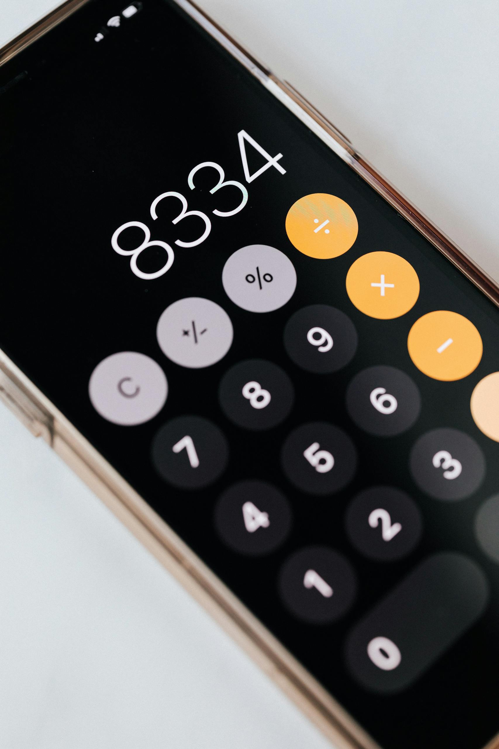 Smartphone with calculator app showing total amount